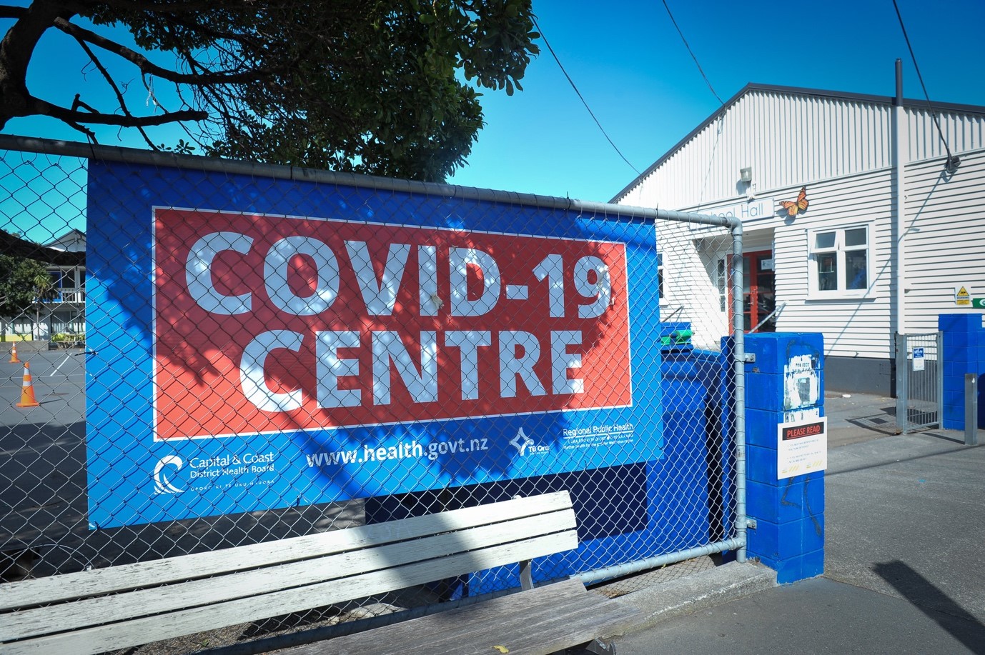 covid sign on fence