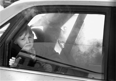 boy in smoke-filled car