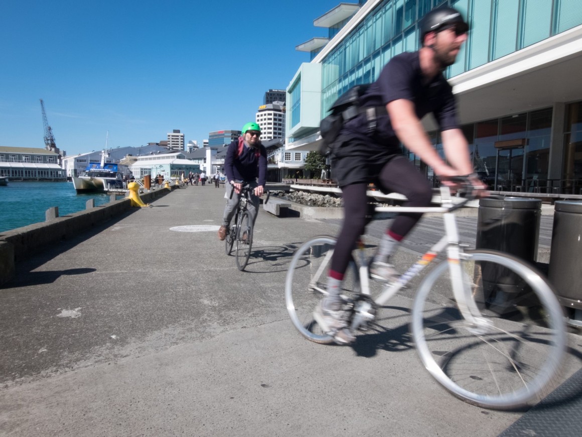 People biking on the waterfront commute