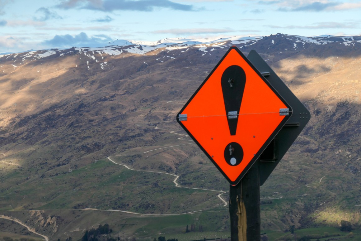 warning sign ("!") in Cardona Valley, New Zealand 
