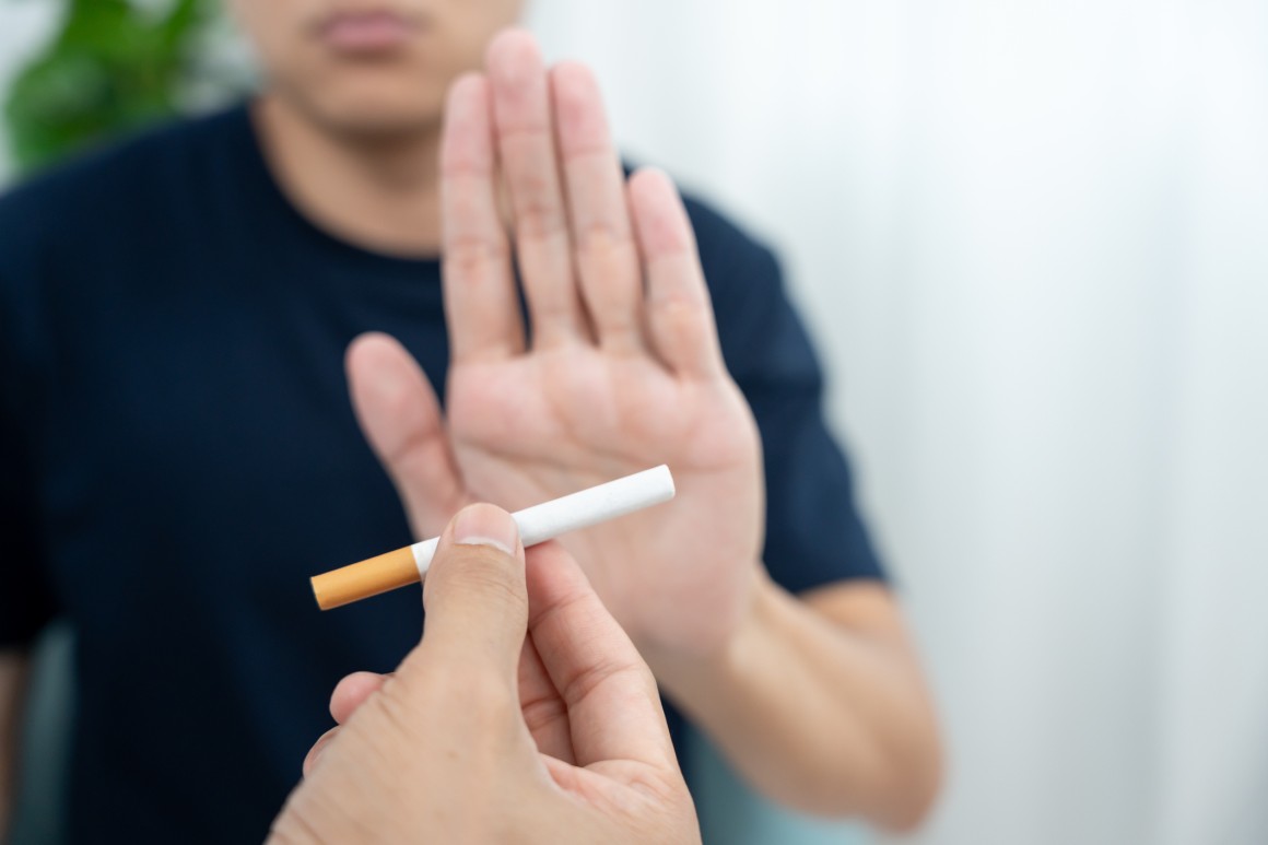 hand rejecting cigarette - young person 