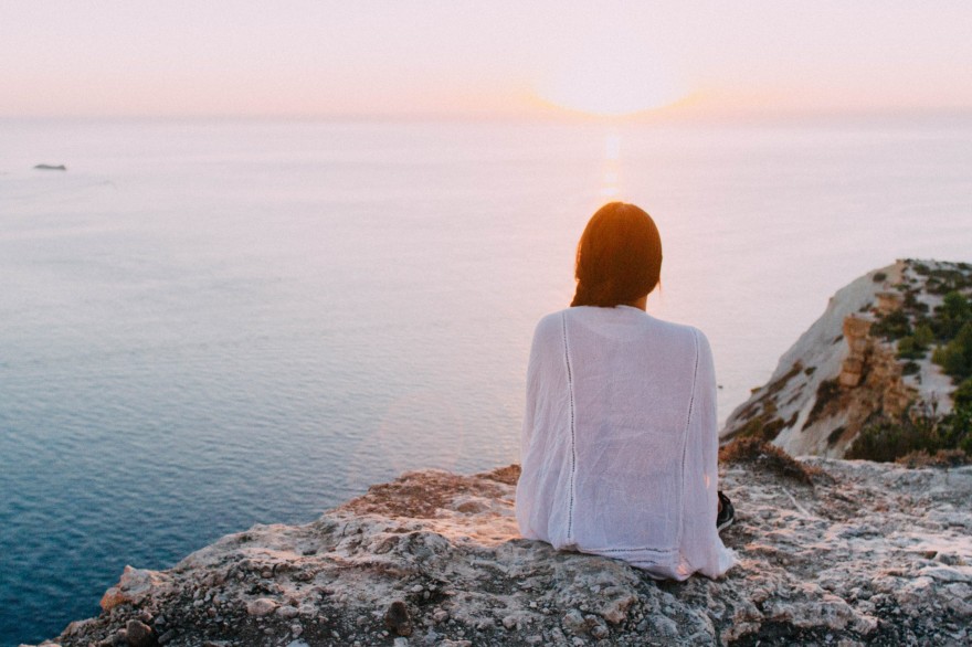 Woman staring wistfully out to sea