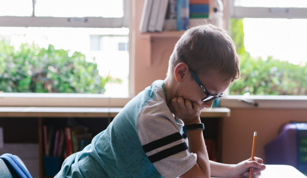 child sitting at school desk