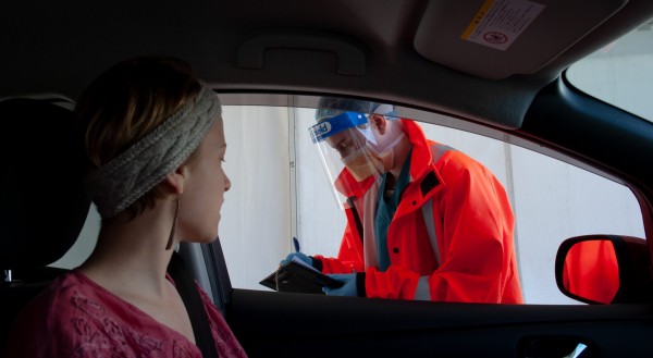 Woman waiting in car to get tested 