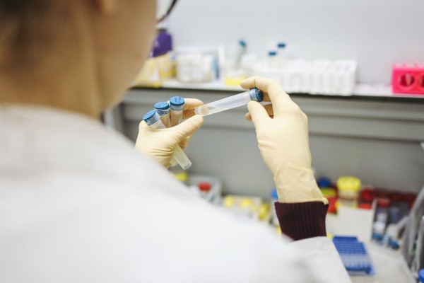 Lab tech testing using tubes