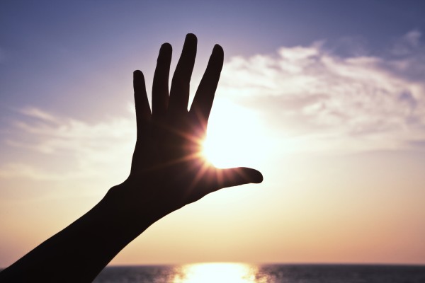 hand blocking sun