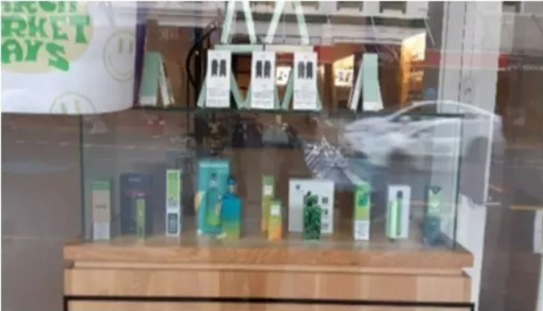 Photo of vape shop window displaying products