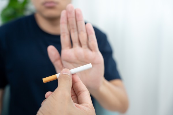 hand rejecting cigarette - young person 