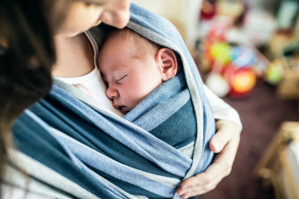 Baby in sling with mother