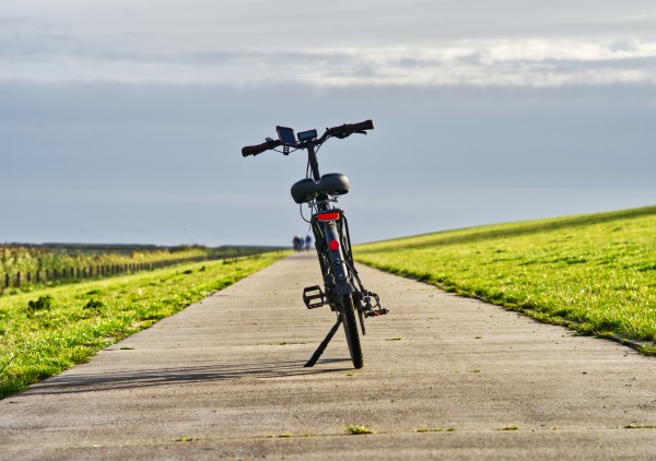 Electric bike on path with riders in the distance