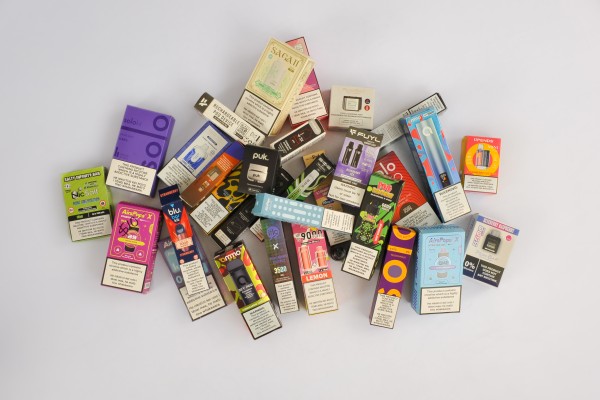 A pile of colourful vapes of various types, colours and flavours